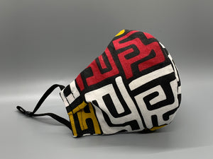 Handmade Triple Layer Cotton Facemask. White, Red, and Mustard symbols maze across black cotton. Gray filter pocket. Overhead/Back of Head cotton loop from same fabric. Adjustable Wood Bead for perfect fit. This mask has no nose wire-the adjustable overhead loop gives you a snug fit. Cut from one cloth-meaning fabric is same and where your pattern lies may vary. non-returnable/non-refundable. non medical grade. not a replacement for medical grade personal protective equipment (PPE), surgical masks, N95s, or