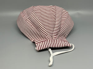 Handmade Triple Layer Cotton Facemask. White and Red Lined Cotton accordion style mask. Fabric enclosed nose wire. Comfy adjustable white elastic earloops. This mask has no filter pocket. Cut from one cloth-meaning fabric is same and where your pattern lies may vary. non-returnable/non-refundable. non medical grade. not a replacement for medical grade personal protective equipment (PPE), surgical masks, N95s, or social distancing. Follow all recommended CDC guidelines.