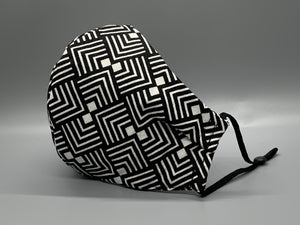  Handmade Triple Layer Cotton Facemask. Black and white lined pattern repeats on this bold fabric. Gray filter pocket. Fabric enclosed nose wire. Comfy adjustable black elastic earloops. Cut from one cloth-meaning fabric is same and where your pattern lies may vary. non-returnable/non-refundable. non medical grade. not a replacement for medical grade personal protective equipment (PPE), surgical masks, N95s, or social distancing. follow all recommended CDC guidelines.