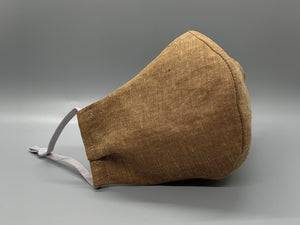 Light brown linen with that perfect wrinkle. Gray filter pocket. Fabric enclosed nose wire. Comfy adjustable gray earloops.  Cut from one cloth-meaning fabric is same and where your pattern lies may vary. non-returnable/non-refundable. non medical grade. not a replacement for medical grade personal protective equipment (PPE), surgical masks, N95s, or social distancing. follow all recommended CDC guidelines.