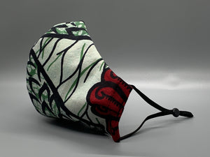 Cool green and black vine with orange, foam, green, and red pattern. Gray filter pocket. Fabric enclosed nose wire. Comfy adjustable black elastic earloops.   Cut from one cloth-meaning fabric is same and where your pattern lies may vary. non-returnable/non-refundable. non medical grade. not a replacement for medical grade personal protective equipment (PPE), surgical masks, N95s, or social distancing. Follow all recommended CDC guidelines.