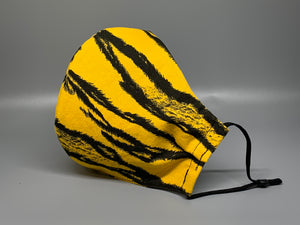 Black Tiger stripes on a deeper yellow cotton. Gray filter pocket. Fabric enclosed nose wire. Comfy adjustable black elastic earloops. 