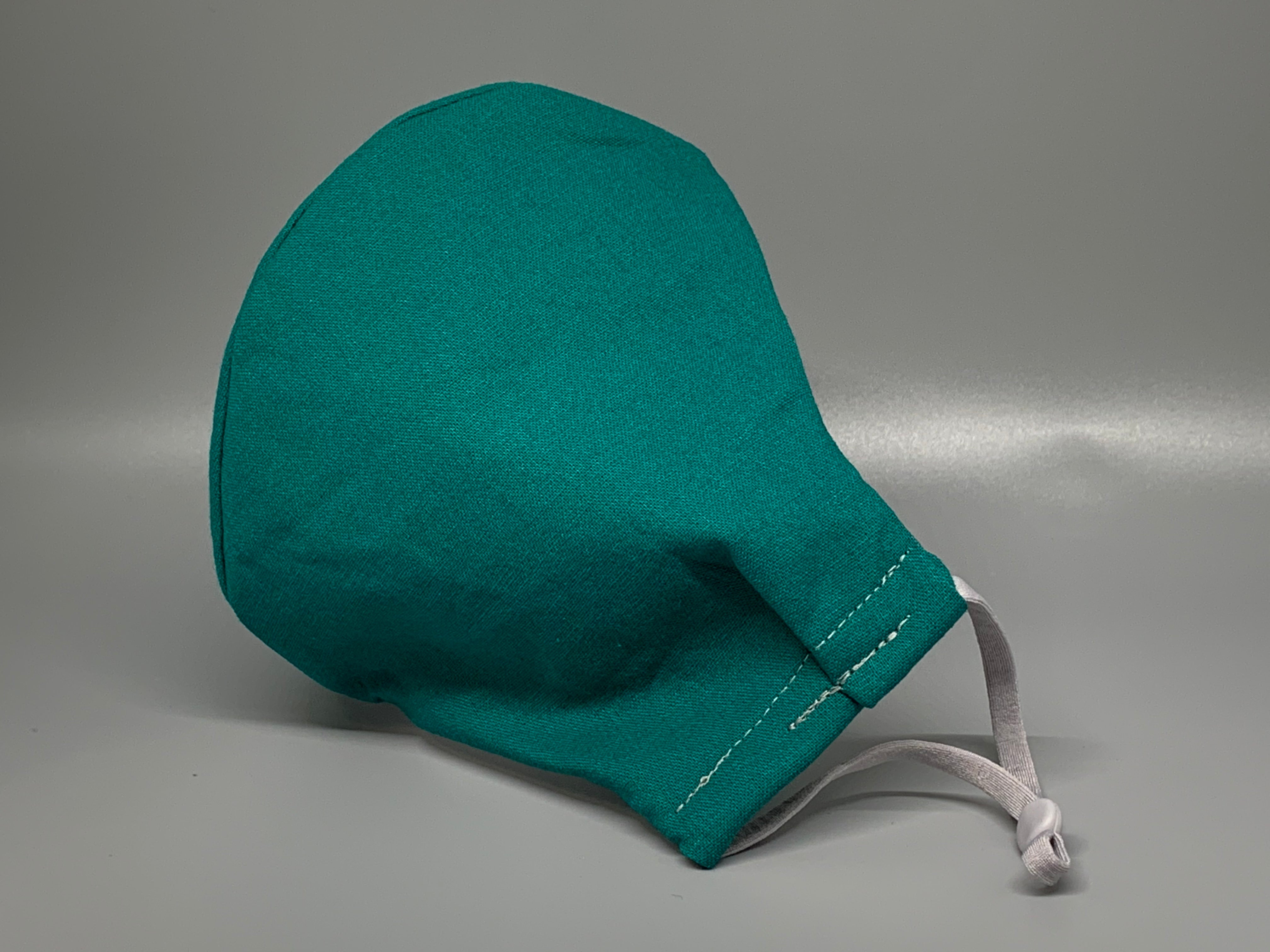 Solid and Bold Deep Teal. Gray filter pocket. Fabric enclosed nose wire. Comfy adjustable gray elastic earloops. 